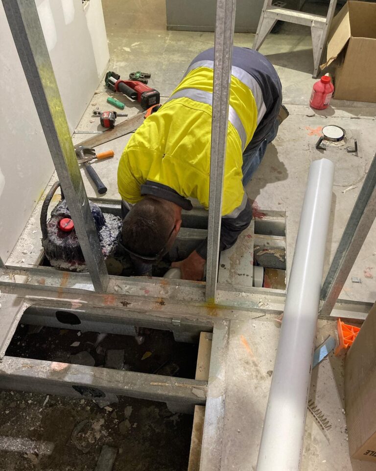 Plumber working on drainage pipes — Plumbing Contractors in Brisbane, QLD