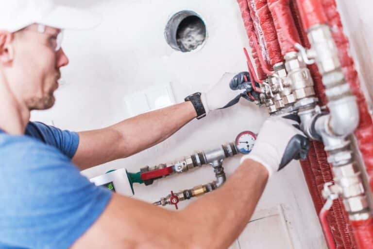 Plumber working on water lines — Plumbing Contractors in D’Aguilar, QLD