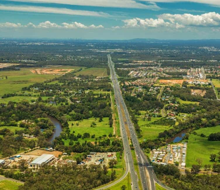 Long road aerial shot — Plumbing Contractors in Caboolture, QLD