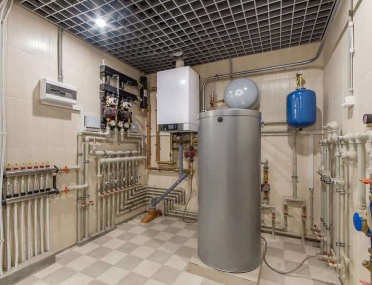 Hot water system inside room — Plumbing Contractors in Woodford, QLD