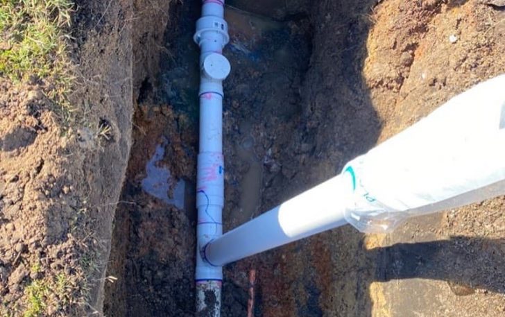 PVC waterline under the ground — Plumbing Contractors in Glass House Mountains, QLD