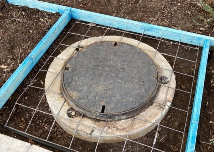 Manhole prepared for cement laying — Plumbing Contractors in Sandstone Point, QLD