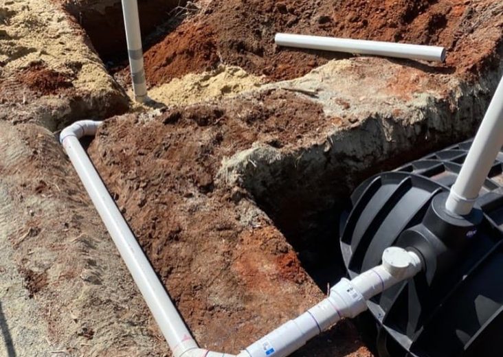 PVC pipes laid on the ground — Plumbing Contractors in Ningi, QLD