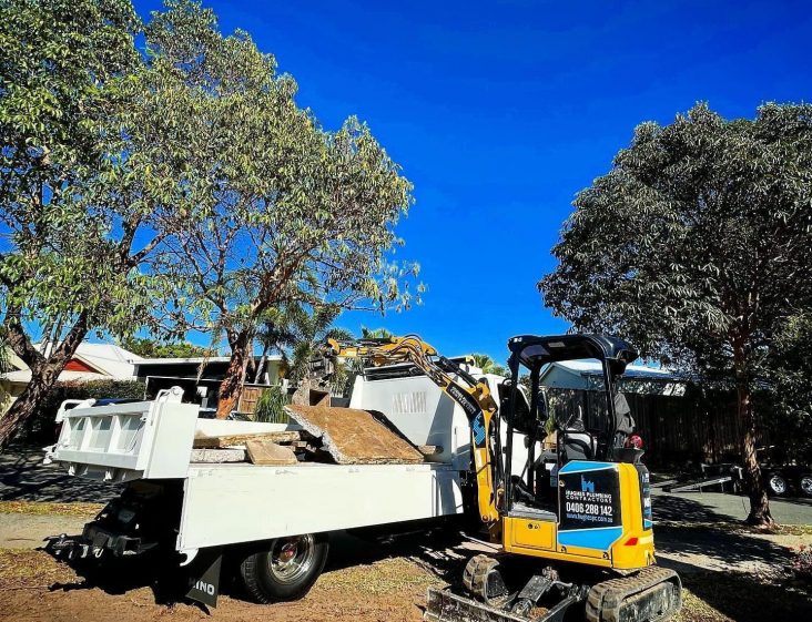 Mini excavator working on backyard — Plumbing Contractors in D’Aguilar, QLD