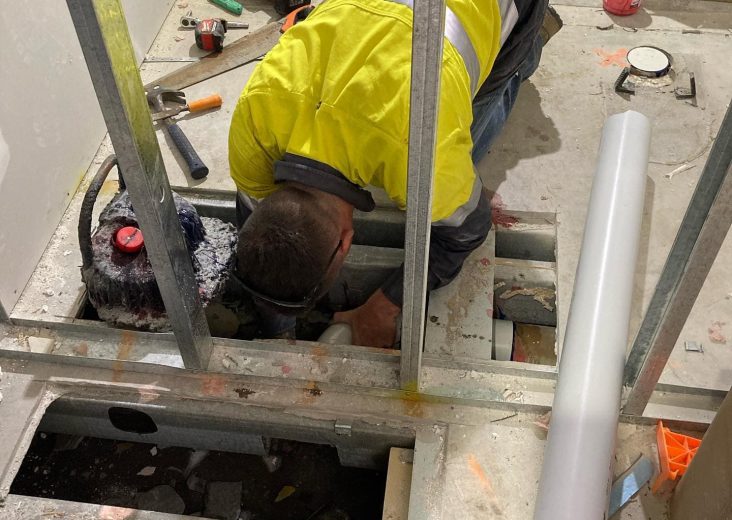 Plumber working on drainage pipes — Plumbing Contractors in Elimbah, QLD