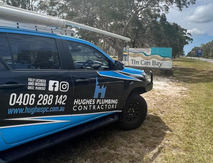 Service truck on field — Plumbing Contractors in Brisbane, QLD