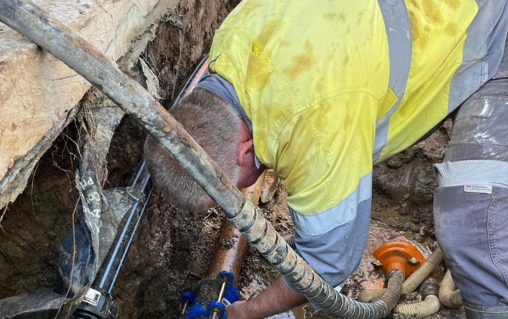 Plumber working on confined space — Plumbing Contractors in Wamuran, QLD