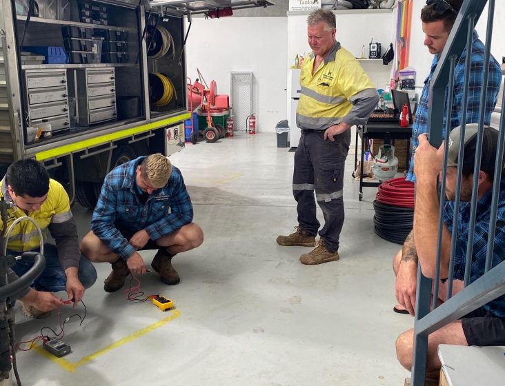 Plumbers working — Plumbing Contractors in Brisbane, QLD