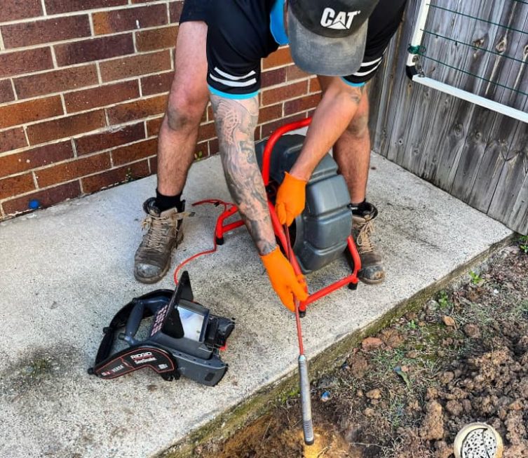 Plumber checking on leak — Plumbing Contractors in Brisbane, QLD